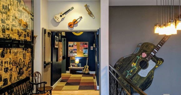 caffe lena guitars on wall