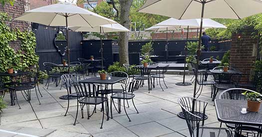 outoor dining patio with tables and chairs